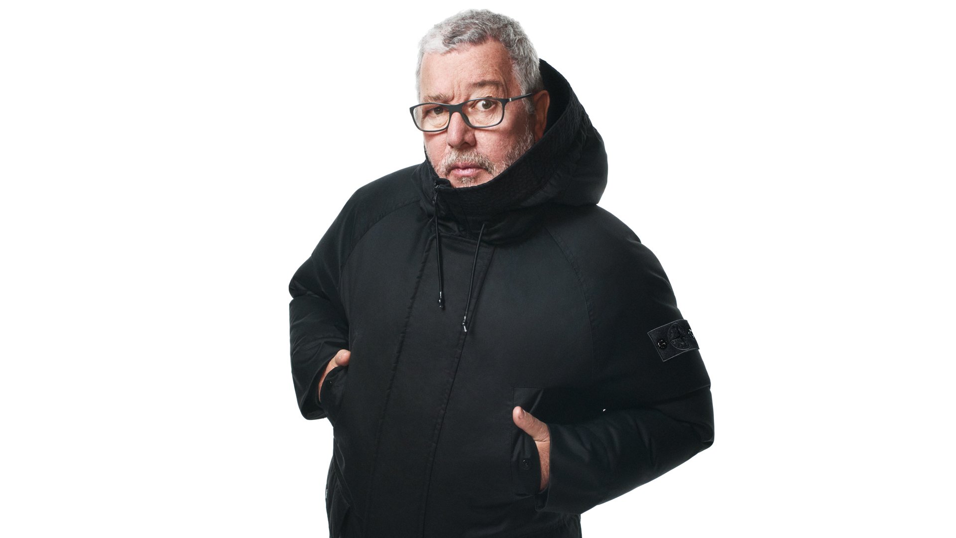 Philippe Starck wearing Stone Island Ghost jacket